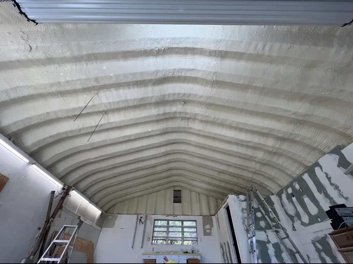Spray polyurethane foam applied to the underside of a metal roof deck in Flagstaff